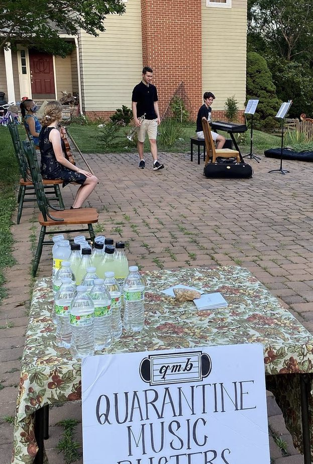 Quarantine Music Busters, Steve Draughn's high school nonprofit, sets up for a performance